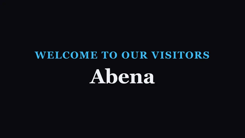 The Welcome to our visitors slide on the projector